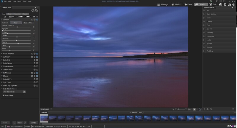 Screenshot of photo editing software showing a twilight coastal landscape with blue and pink tones in the Develop module.