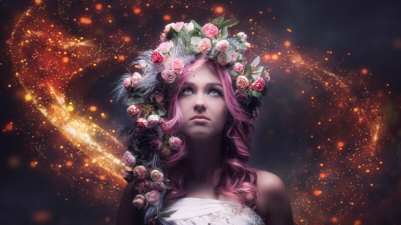 Woman with flowing purple hair wearing a floral crown, surrounded by glowing golden particles and light effects.