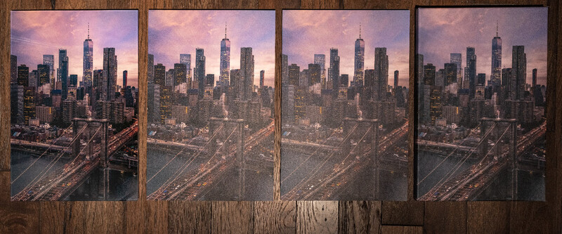 Four framed photographs of a Manhattan skyline at dusk mounted on weathered wood paneling.