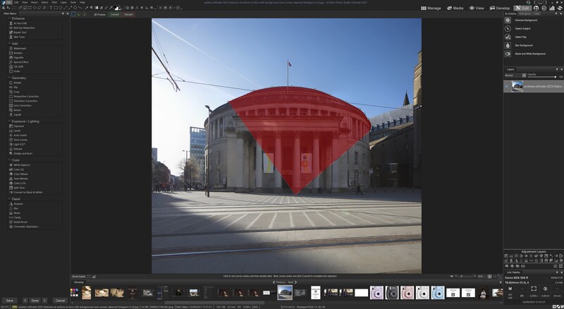 Screenshot of photo editing software showing a cityscape with a large red semi-transparent overlay on a classical building.