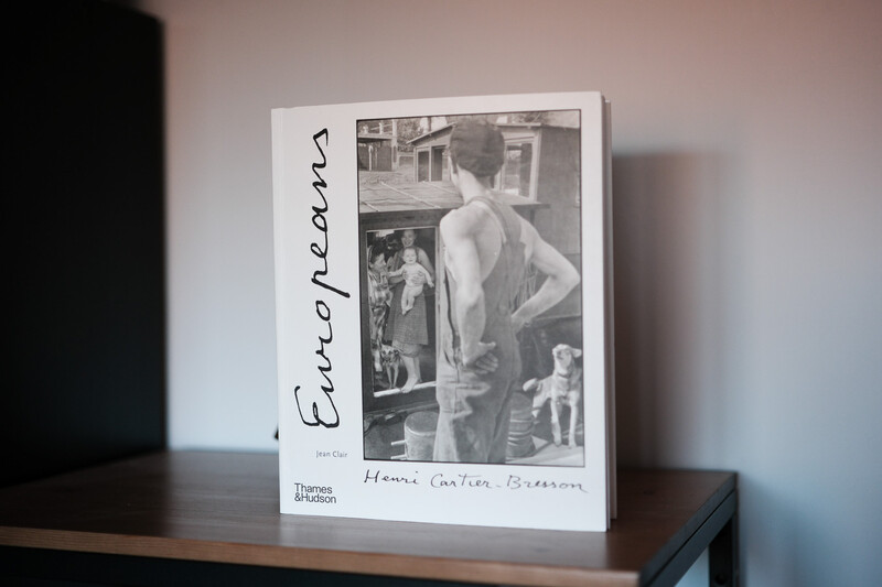 Book cover featuring black and white photograph of shirtless man viewed from behind in an interior space.