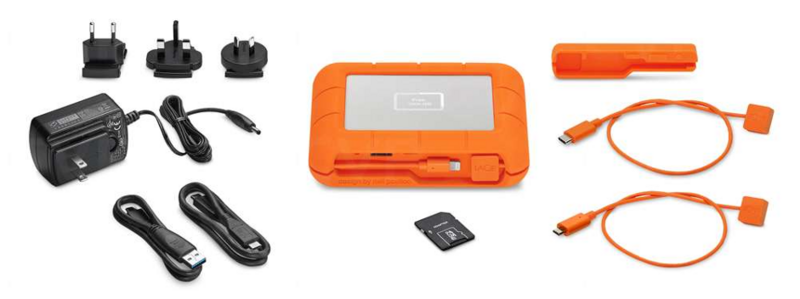 LaCie Rugged portable storage device in orange with accessories including power adapter, cables, and SD card.