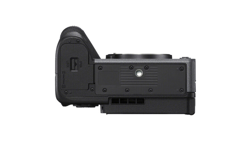 Side view of a black mirrorless camera body with articulating screen and grip.