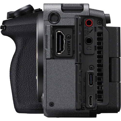 Side view of a compact mirrorless camera body showing ports and controls.