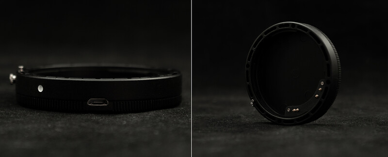 Two views of a black camera lens adapter ring shown against a dark textured surface.