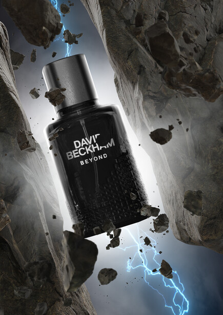 Dark fragrance bottle suspended mid-air against rocky terrain with lightning effects and floating debris.
