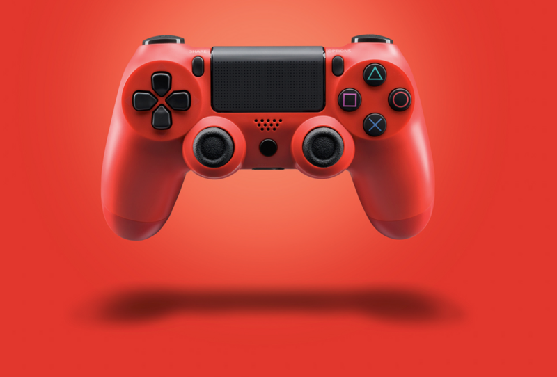 Red wireless gaming controller centered against a solid red background with shadow beneath.