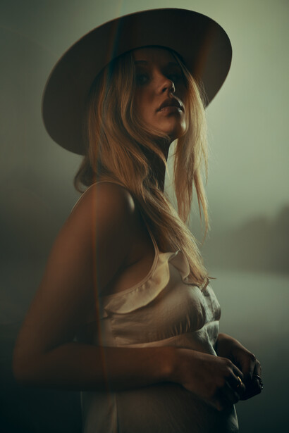Portrait of a woman wearing a hat.