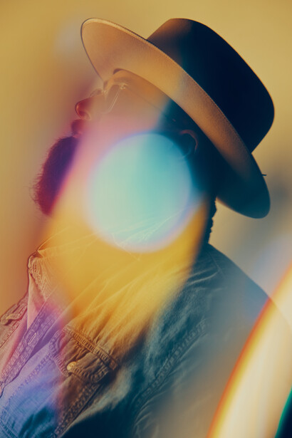 Portrait of a man wearing a hat.