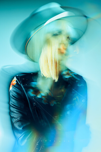 Portrait of a woman wearing a hat.