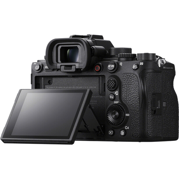 Professional mirrorless camera with articulating LCD screen extended, shown from rear three-quarter angle.
