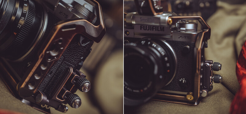 Close-up of a Fujifilm camera body with lens and textured grip against a neutral background.