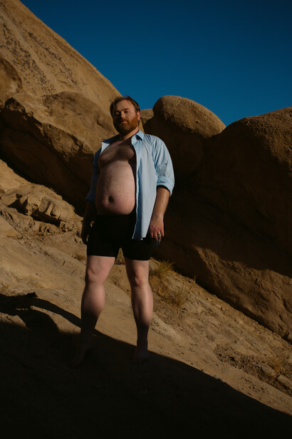 Man standing on rocky hill