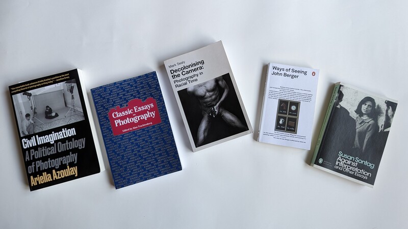 Five photography and visual culture books arranged on a white surface.