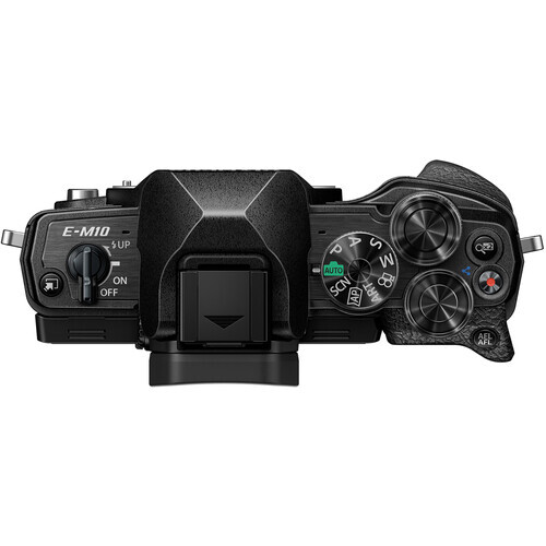 Top-down view of a mirrorless camera body with dual control dials and articulating screen displayed against white background.