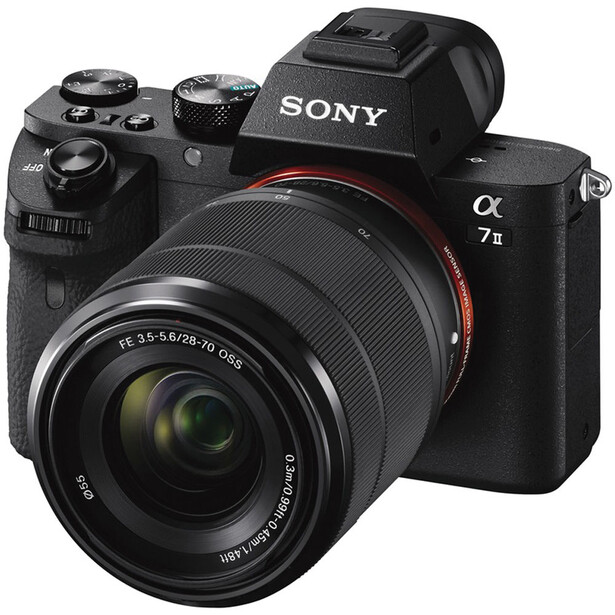 Sony α7 II mirrorless camera with attached 28-70mm kit lens against white background.
