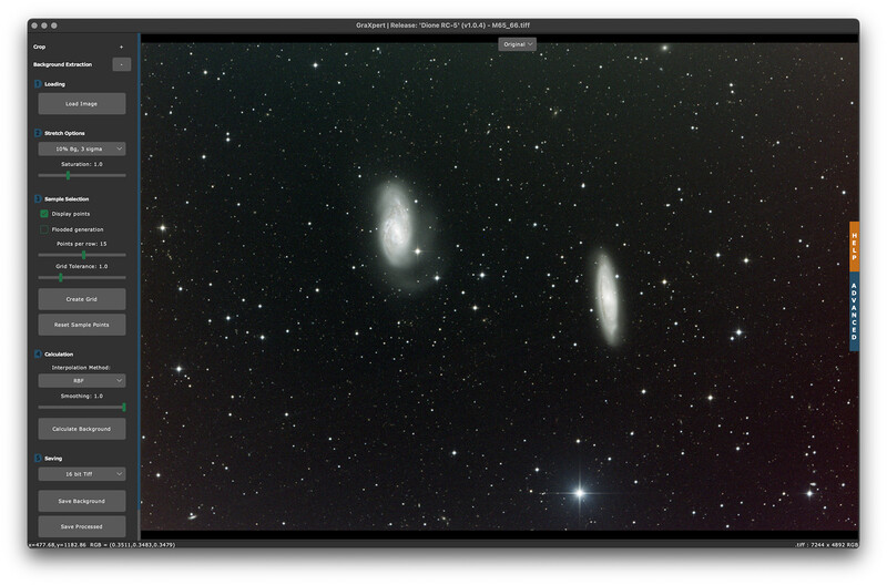 Screenshot of astronomy software displaying two spiral galaxies among starfield.