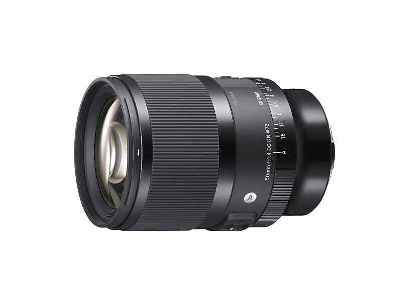 Black telephoto camera lens with focus ring and depth-of-field scale markings.