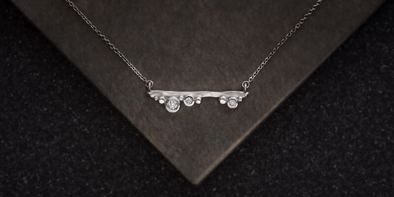 Diamond &amp; Silver Pendant on Tiles