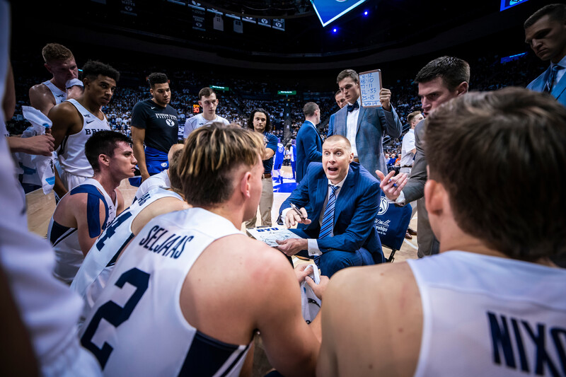 Coach talking to basketball players