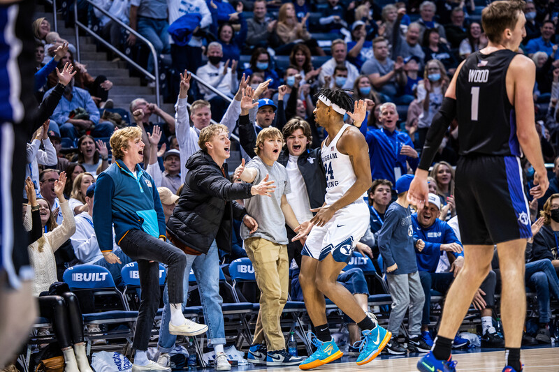 Basketball players celebrating with fans