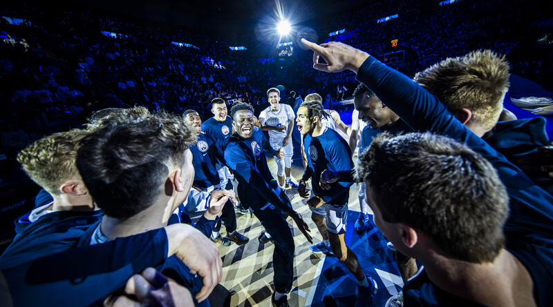 Basketball players dancing before the start of a game