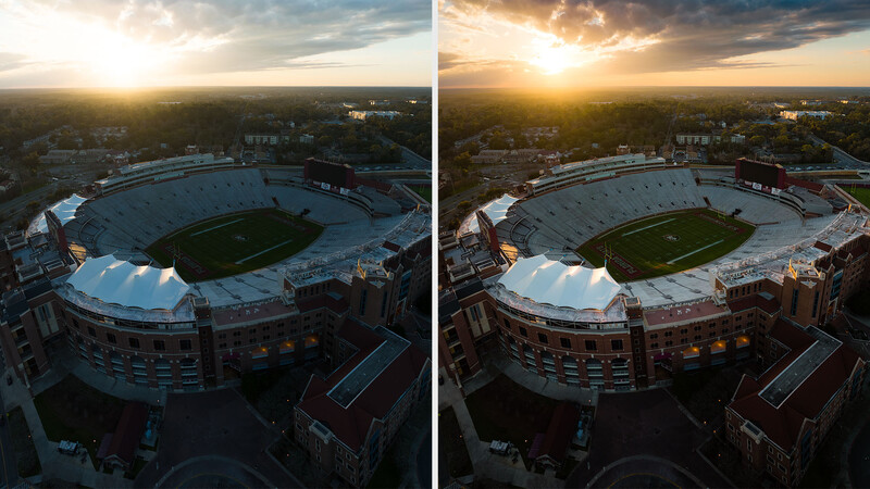 Aerial view of a large football stadium at sunset with surrounding cityscape and river.