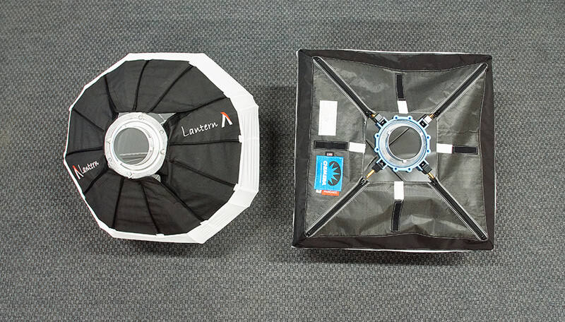 Two octagonal and square softbox diffusers displayed from above on gray fabric, showing interior construction and attachment mechanisms.