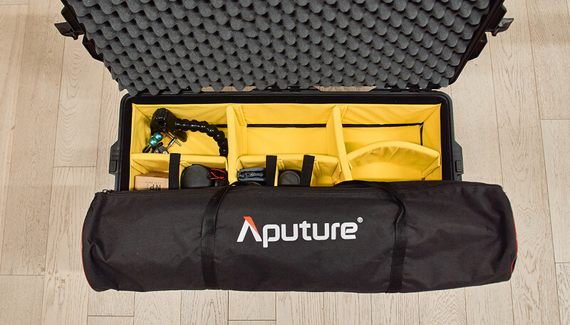 Aputure equipment case opened to reveal yellow foam compartments holding lighting gear and accessories.