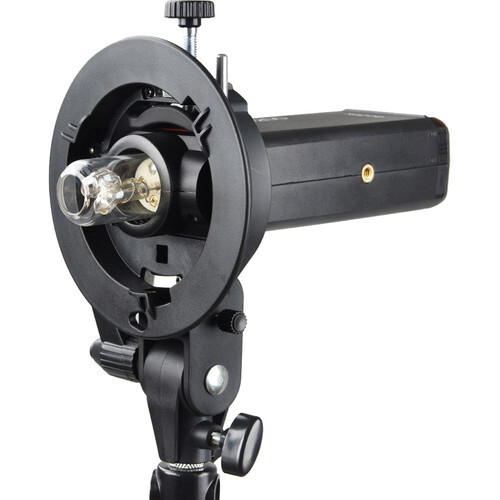 Studio flash head with reflector and modeling light mounted on adjustable bracket.