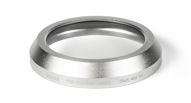 Silver lens adapter ring with engraved text for Fujifilm X100 series cameras.