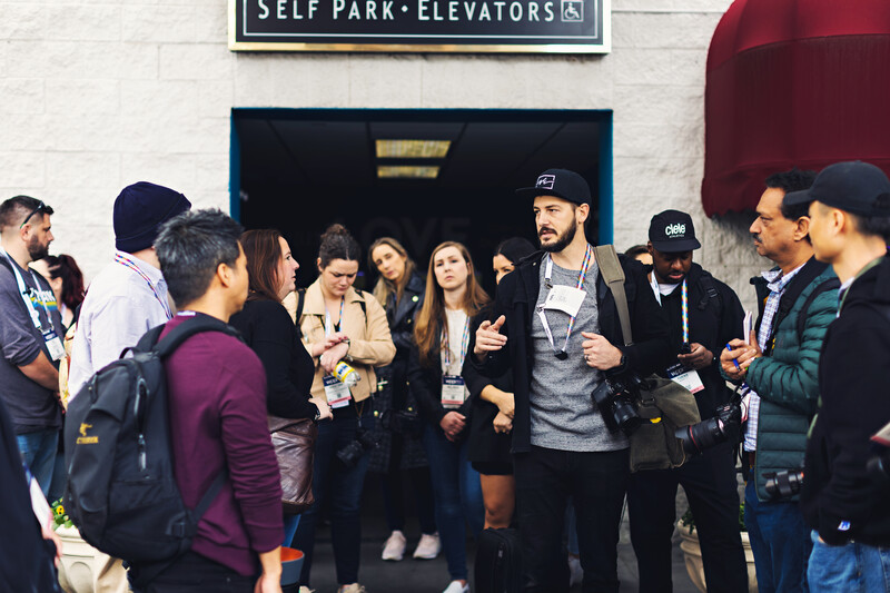 Group of people gathered at the entrance to a self-park elevators building.