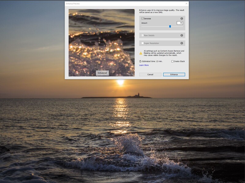 Golden hour seascape with waves and distant lighthouse at sunset.