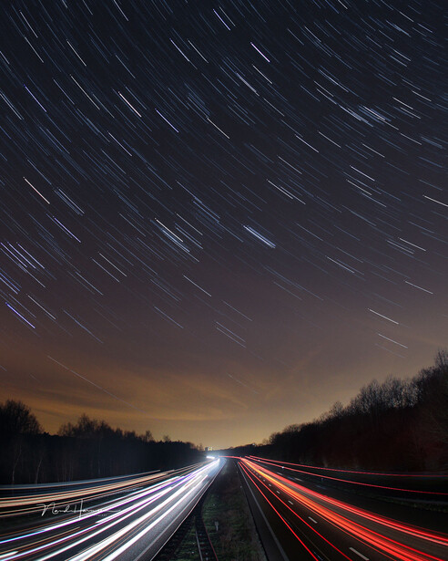 The car lights are much brighter compared to the stars. I had to find the right exposure time to prevent over exposure while capturing enough stars