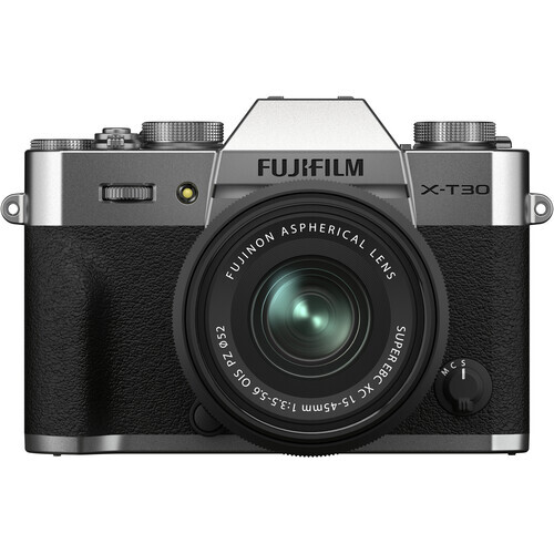 Fujifilm X-T30 mirrorless camera with silver top plate, black body, and attached 18-55mm lens.
