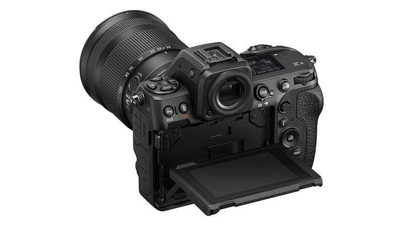 Professional mirrorless camera body with attached zoom lens and open articulating screen.