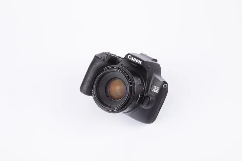 Canon EOS 5D Mark IV DSLR camera with 50mm lens mounted, displayed against white background.