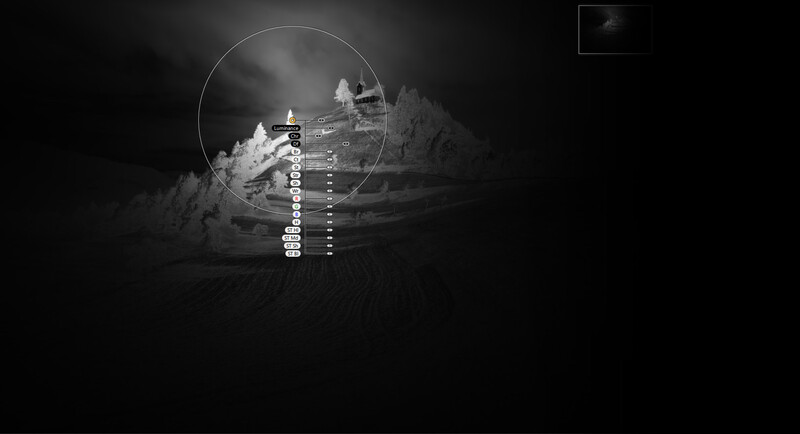 Thermal or night vision scope view of a distant structure with crosshair reticle overlay.