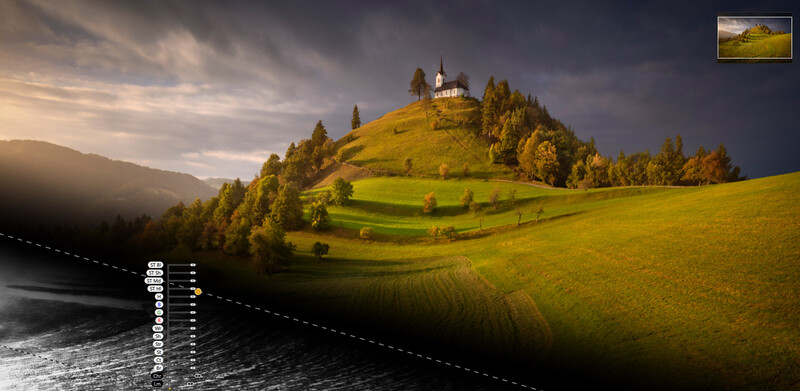 Alpine hillside with a white church on a grassy peak, surrounded by evergreen forest and mountains under dramatic cloudy sky.
