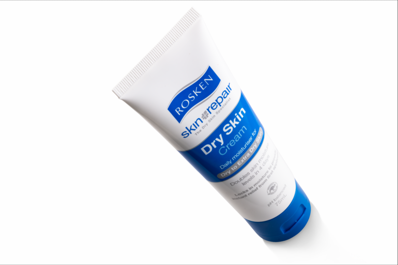 Tube of blue and white skincare product shot at an angle against a white background.