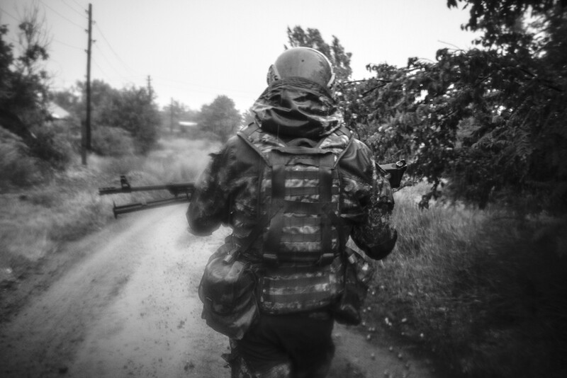 Donbass, Ukraine 2018 - Running back to safety during a strong rainstorm