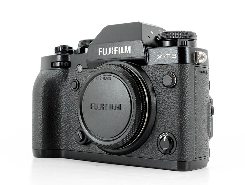 Fujifilm X-T5 mirrorless camera body shown from a three-quarter front angle against a white background.