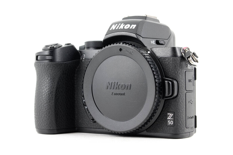 Nikon Z50 mirrorless camera body shown from the front and right side against a white background.
