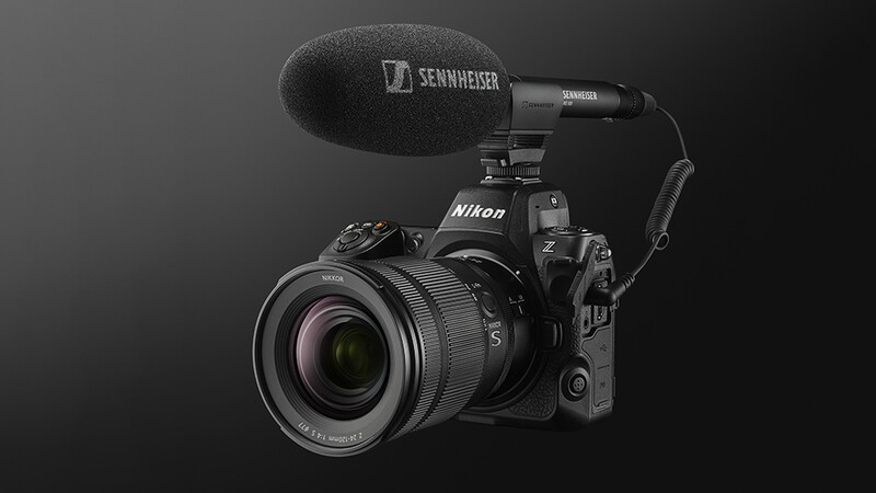 Nikon Z9 mirrorless camera with Sennheiser microphone mounted on top against dark background.