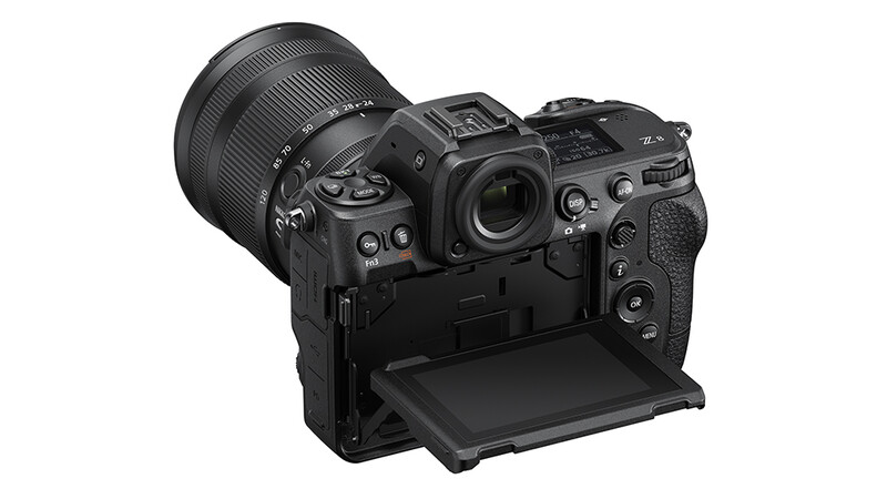 Professional mirrorless camera with attached zoom lens and open LCD screen on bottom panel.