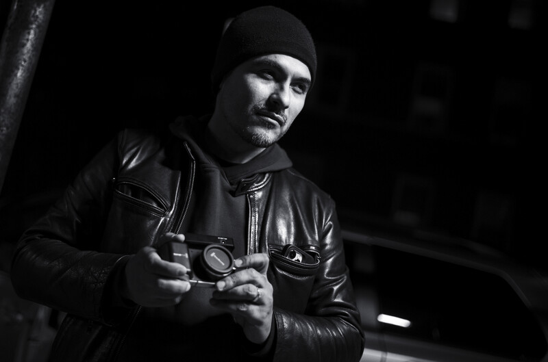 Portrait of a man holding a camera