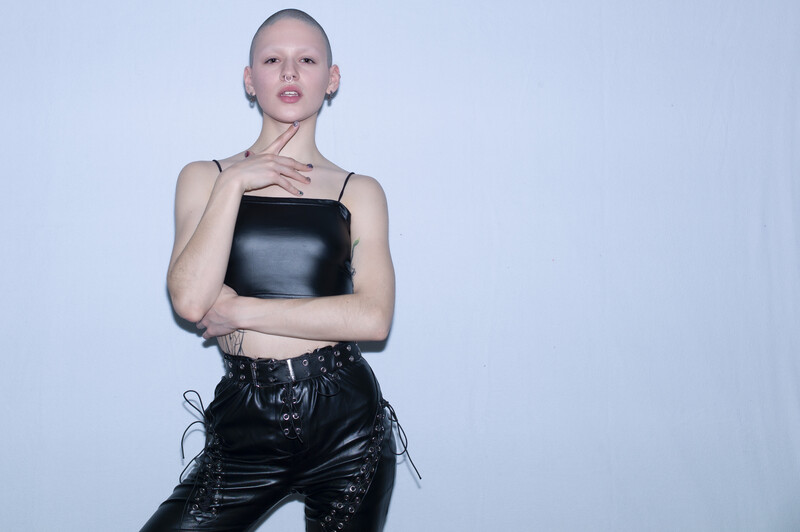 Bald woman dressed in leather
