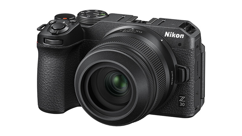 Nikon Z30 mirrorless camera with attached zoom lens, shown from a three-quarter angle against a white background.