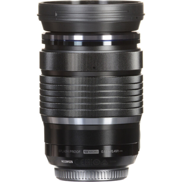 Black telephoto lens with multiple focusing rings and metal bands, shown against white background.
