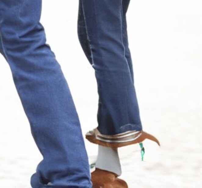 A crop of Ai-generated content using Adobe's Generative Fill, showing an example of how it struggles with feet